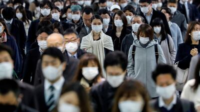 People wear face masks at Shinagawa station during the rush hour after the government expanded a state of emergency to include the entire country following the coronavirus disease outbreak, in Tokyo, Japan. Reuters
