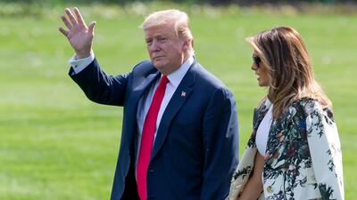 US President Donald Trump and First Lady Melania Trump walk on the South Lawn of the White House to Marine One in Washington. EPA