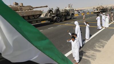 Young boys greet the returning heroes.