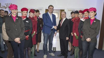 Aleksandar Vučić, the prime minister of the Republic of Serbia, left, and James Hogan, Etihad Aviation Group's president and chief executive, celebrate the opening of the call centre for Etihad's partner airlines. Courtesy Etihad