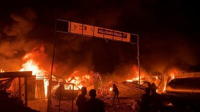 A fire rages in the Rafah camp hit by an Israeli air strike. Women and children were among those killed. Reuters