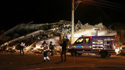 Rescuers work on a collapsed building in Elazig province. Reuters