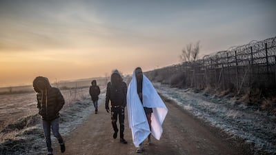 Migrants walk towards the Greek border in Pazarkule, in the Edirne district. Thousands of migrants stuck on the Turkey-Greece border clashed with Greek police. AFP