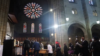 Mourners carry Tutu's coffin into the church. AP