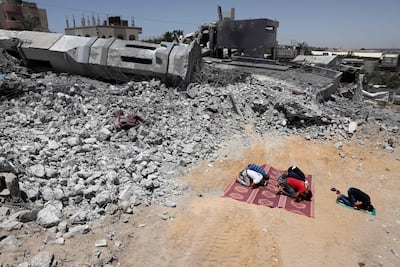 A file photo of Palestinian worshippers praying near the rubble of a destroyed mosque in Beit Lahia, in the northern Gaza Strip. AFP