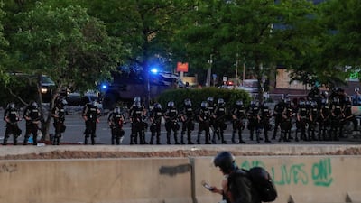 Security forces stand guard during a protest in Minneapolis, Minnesota, US. Reuters