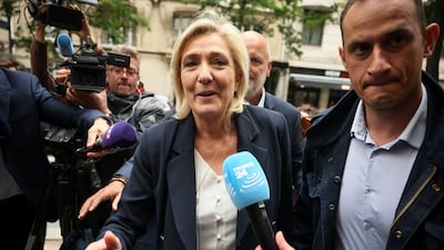 French far-right leader Marine Le Pen arrives at the National Rally party headquarters in Paris. AP