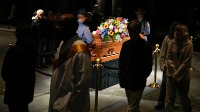 Members of the public pay their respects. AFP