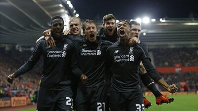 Divock Origi celebrates with Liverpool teammates after scoring the fourth goal for the team in their 6-1 League Cup win over Southampton. Eddie Keogh / Reuters