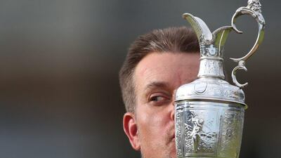 Henrik Stenson of Sweden kisses the trophy after winning the British Open Golf Championships at the Royal Troon Golf Club in Troon, Scotland, Sunday, July 17, 2016. Peter Morrison / AP Photo