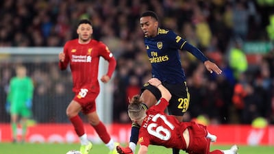 Liverpool's Harvey Elliott and Joe Willock of Arsenal battle for the ball. PA