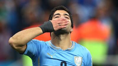 Luis Suarez gestures to the crowd during Uruguay's 2-1 win over England on Thursday night at the 2014 World Cup. Julian Finney / Getty Images / June 19, 2014