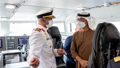 Rear Admiral Pilot Sheikh Saeed bin Hamdan, Commander of the UAE Naval Forces, speaks with Sheikh Mohamed bin Zayed during the Crown Prince of Abu Dhabi's tour of Navdex on Tuesday. Ministry of Presidential Affairs