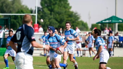 Gulf Legends (dark blue) v Airbus (light blue stripes) during Day 1 of the Emirates Airlines Dubai Rugby Sevens at The Sevens in Dubai on Thursday. Victor Besa for The National