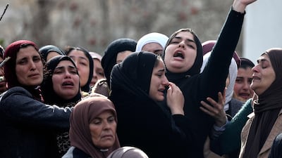 Palestinians mourn during the funeral of Abdulhadi Nazzal, who was killed in a raid by Israeli forces in Qabatia town, in the occupied West Bank. AFP