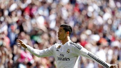 Real Madrid's Cristiano Ronaldo raises five fingers to celebrate his fifth goal, Madrid's ninth, in their 9-1 La Liga victory on Sunday against Granada. Juan Carlos Hidalgo / EPA