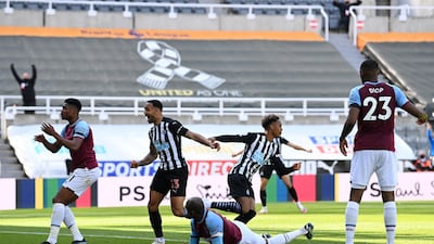 Joe Willock of Newcastle United celebrates after scoring his team's third goal against West Ham United at St James' Park. Getty