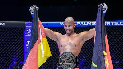Emilio Quissua celebrates his victory against Kevin Oumar in the light heavyweight title fight during UAE Warriors Africa at the Etihad Arena in Abu Dhabi. All images Victor Besa / The National