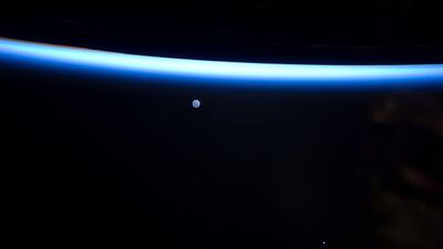 March 6 2011: The Earth's thin line of atmosphere and a gibbous moon photographed by an Expedition 26 crew member on the International Space Station. AP Photo/NASA