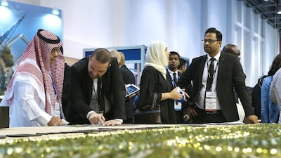 Visitors take a closer look at one of Damac's residential projects. Satish Kumar / The National