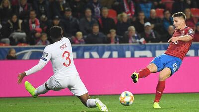 Czech Republic's midfielder Lukas Masopust (R) shoots past England's defender Danny Rose during the UEFA Euro 2020 qualifier Group A football match Czech Republic v England at the Sinobo Arena. AFP