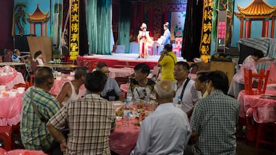 Guests enjoy a meal while watching the show. EPA