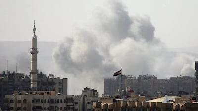 Smoke rises from Yarmouk Palestinian camp in Damascus, Syria on April 20, 2018. Ali Hashisho / Reuters