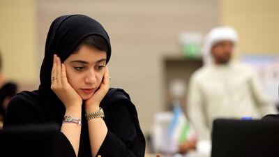 Emirati Kholoud Essa Al Zarouni ponders her next move at the Asian Nations Cup Chess Championship yesterday at the Novotel hotel in Abu Dhabi. The UAE is hosting the championship for a third consecutive year. Ravindranath K / The National