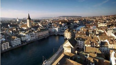 The view across the Limmat River and Zurich's old town from the top of Grossmunster Cathedral. Alamy