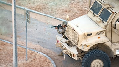Armed soldiers at a drill at the Al Hamra Camp.