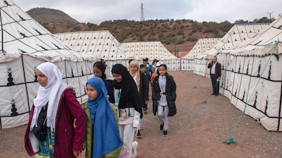 Children attend classes in a tent school prepared by the Moroccan army for pupils affected by the earthquake, in the village of Asni, south of Marrakesh. EPA
