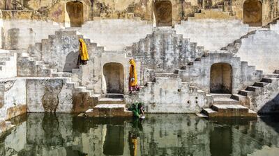 Women carry water at step well in Jaipur, one of the world's newest Unesco World Heritage Sites. Getty Images