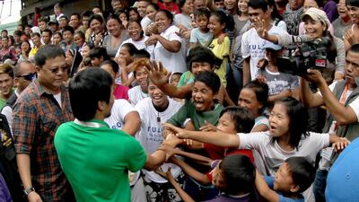 Manny Pacquiao greets fans in General Santos last year after a morning training session. Mike Young for The National / October 6, 2014