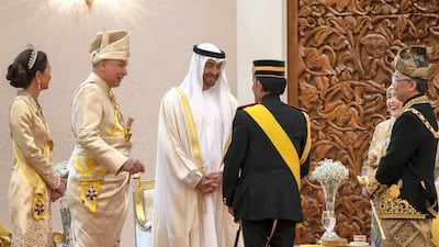Sheikh Mohamed bin Zayed, Crown Prince of Abu Dhabi and Deputy Supreme Commander of the Armed Forces (3rd L) speaks with Brunei's Sultan Hassanal Bolkiah during the inauguration of King Abdullah Ahmad Shah at Istana Negara, the national palace of Malaysia. Ministry of Presidential Affairs