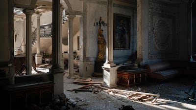 Broken glass and window frames lay on the floor of the Sursock Palace. AP Photo