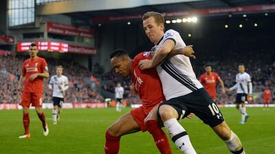 Tottenham’s Harry Kane, right, in action against Liverpool’s Nathaniel Clyne. Peter Powell / EPA