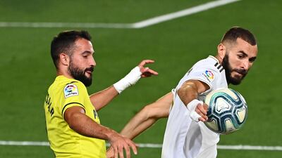 Villarreal's defender Mario Gaspar challenges Real Madrid's Karim Benzema. AFP