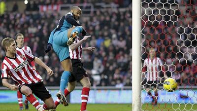 Arsenal's Thierry Henry scores against Sunderland in 2012. AFP