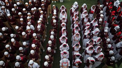 Pakistani students attend prayers in Karachi. Fareed Khan / AP Photo