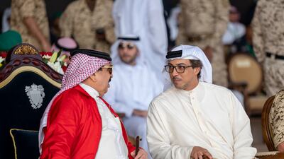 Sheikh Mansour speaks with King Hamad.