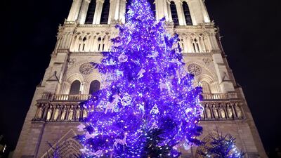 A giant Christmas tree stands in front of Notre Dame Cathedral in Paris, France. Reuters