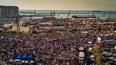 Demonstrators gather outside the port of Lebanon's capital Beirut on the first anniversary of the blast that ravaged the city. AFP