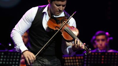 Tunisian violinist Mohamed Gharbi performs during a concert at the Carthage Music Days in Tunis, Tunisia. EPA