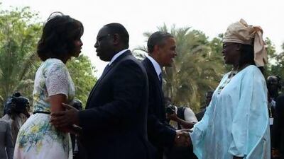 US President Barack Obama (second right) and first lady Michelle Obama (left) are greeted by Senegal President Macky Sall (second left) and his wife Mariame at the presidential palace in Dakar.