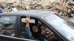 A defiant gesture as a Lebanese couple return to their home, after a 10-day ceasefire between Israel and Hezbollah came into effect, in the southern suburbs of Beirut. Reuters