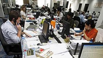 Journalists at the Gulf Daily News, the English-language sister paper of Akhbar Al Khaleej, at work in Manama. Bahraini authorities suspended the latter's publishing rights for a day.