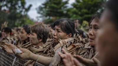 Devotees covered in mud and dried banana leaves take part in the Taong Putik ("mud people") Festival in the village of Bibiclat in Aliaga town, Nueva Ecija province, Philippines. Each year, the residents of Bibiclat village in Aliaga town celebrate the Feast of Saint John by covering themselves in mud, dried banana leaves, vines, and twigs as part of a little-known Catholic festival. Getty Images