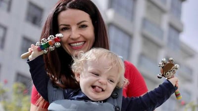 Rhian Adams and her son Samson Oliver Turton marked Angelman Syndrome day by taking part in a beach walk with members of Help for Heroes and two other children with the disorder. Photo: Brittany Joy