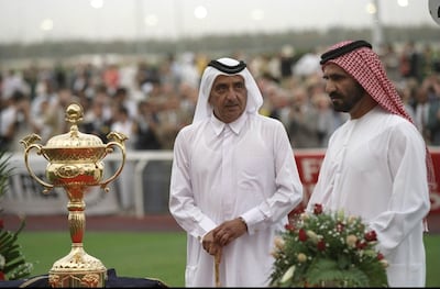 Sheikh Maktoum bin Rashid, left, and Sheikh Mohammed bin Rashid at the first Dubai World Cup in 1996. Getty Images