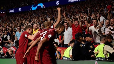 Liverpool's players celebrate Divock Origi's goal. AFP